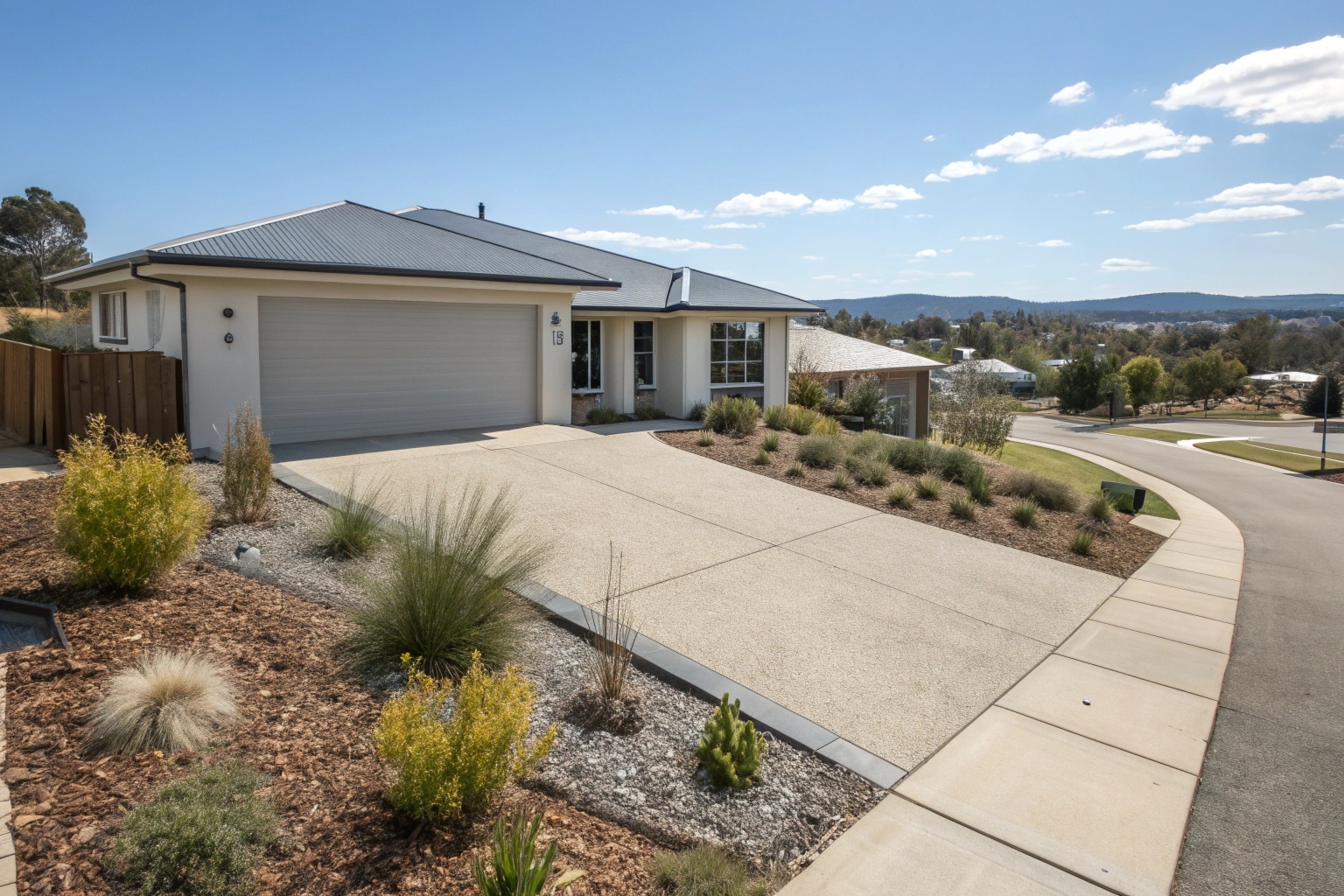 Exposed aggregate concrete driveway Jerrabomberra home