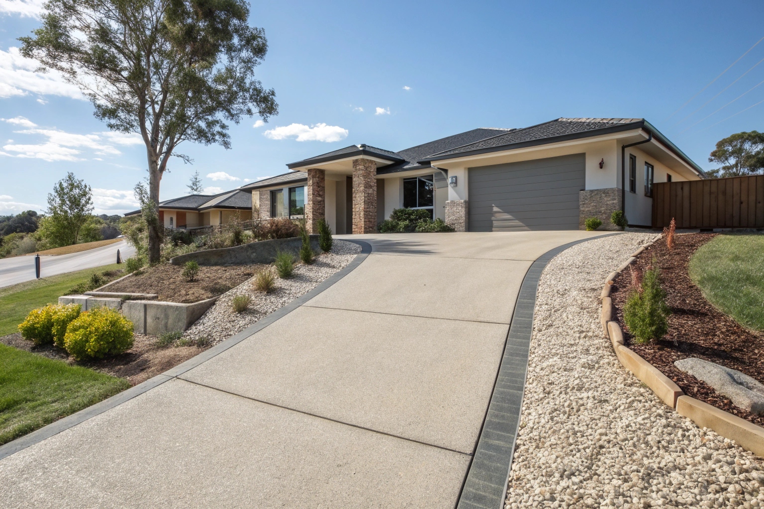 Exposed aggregate concrete driveway Gungahlin modern home