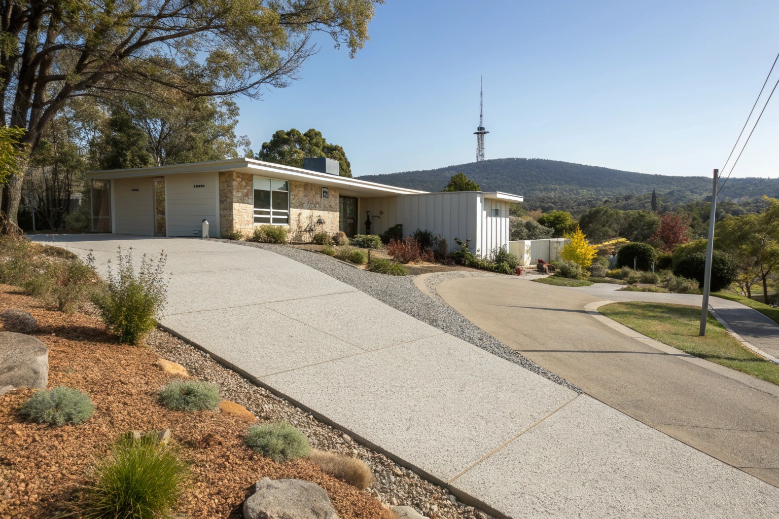 Concrete driveway installation Canberra Central modern home